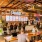 inside of a restaurant with a bar and people 