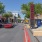 a road with cars and attractions on each side