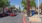 a road with cars and attractions on each side