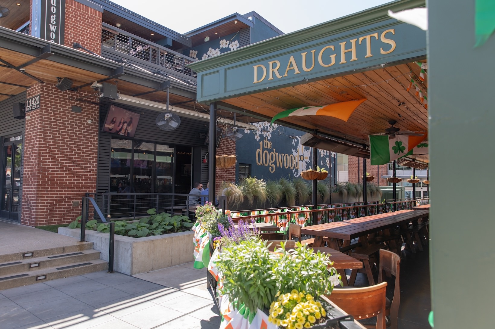The Dogwood outdoor patio with covering and chairs and tables