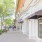 a sidewalk with shops on the right