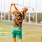 a person swinging a golf club at a driving range