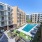A view of the courtyard, cabana, and resort-style pool and surrounding apartment windows and balconies at The Met in Austin, TX.