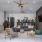 covered outdoor lounge with ceiling fans and couch