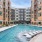 in-pool loungers on tanning ledge with fountains